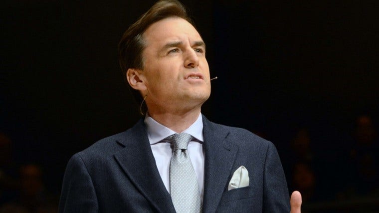 The image shows a gentleman saying something