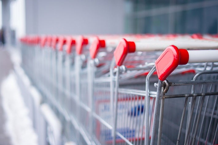 Image of a long row of shopping carts stacked together